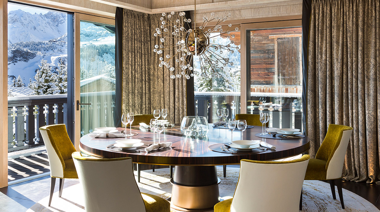 Sybille de Margerie - French interior designer - Chalet A, located in Courchevel 1850 - contemporary chalet - contemporary dining room - leather and fabric chair - John Hutton - round dining room table in ebony and bronze - Promemoria - Rug Tai Ping - Signatures Singulières magazine - The digital magazine of French talent
