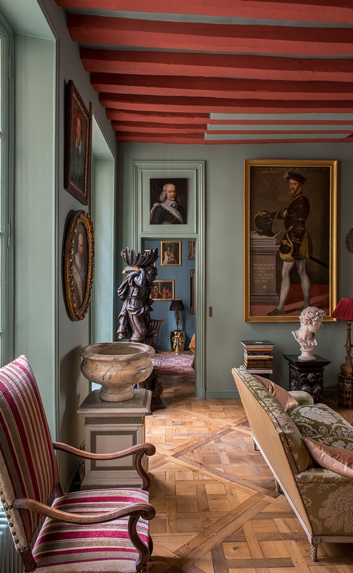 CM Studio Paris - french agency interior designer - baroque apartment in paris - Ile de la Cité - versailles flooring - green wall - red lampshade - louis XIII armchair - coral color on beams